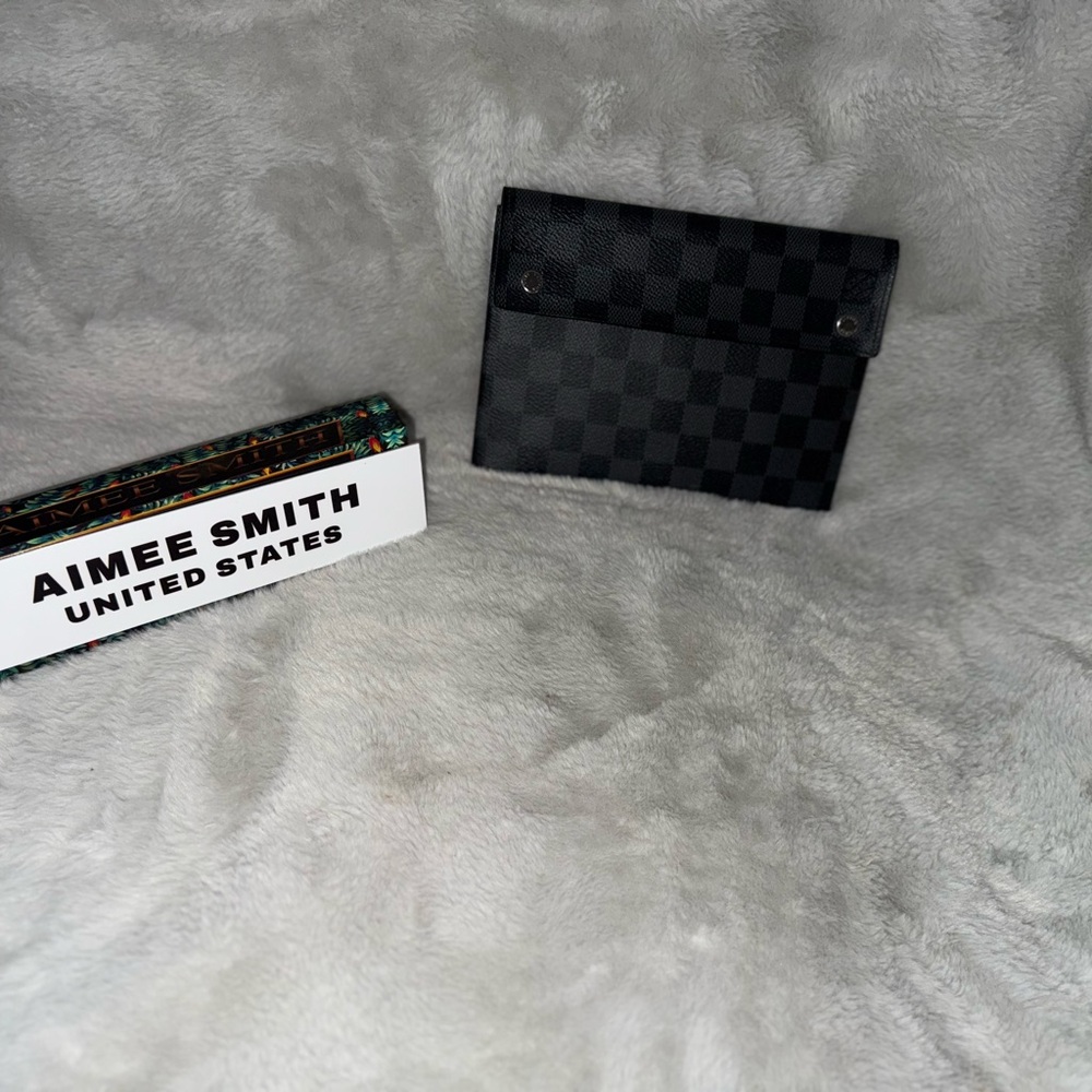 Louis Vuitton Graphite pouch with yellow/green interior. 2 snaps. 7.5”L/5.5”W